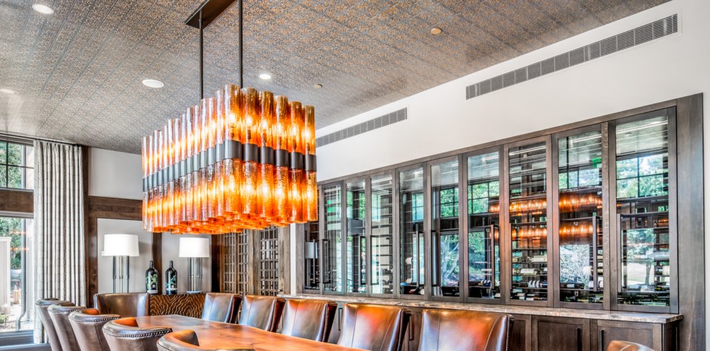 A unique lighting fixture above a long table